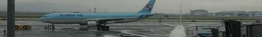 Gimhae International Airport exterior in Busan at dusk