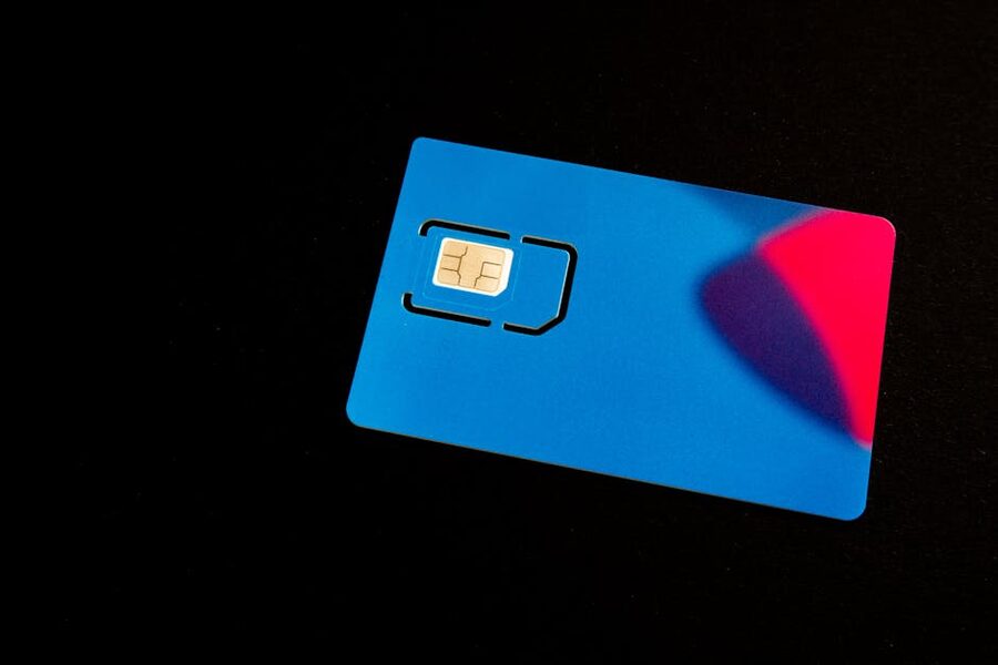 Blue SIM card close-up on dark background