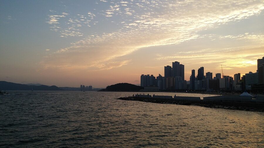 Haeundae Beach at sunset with city lights