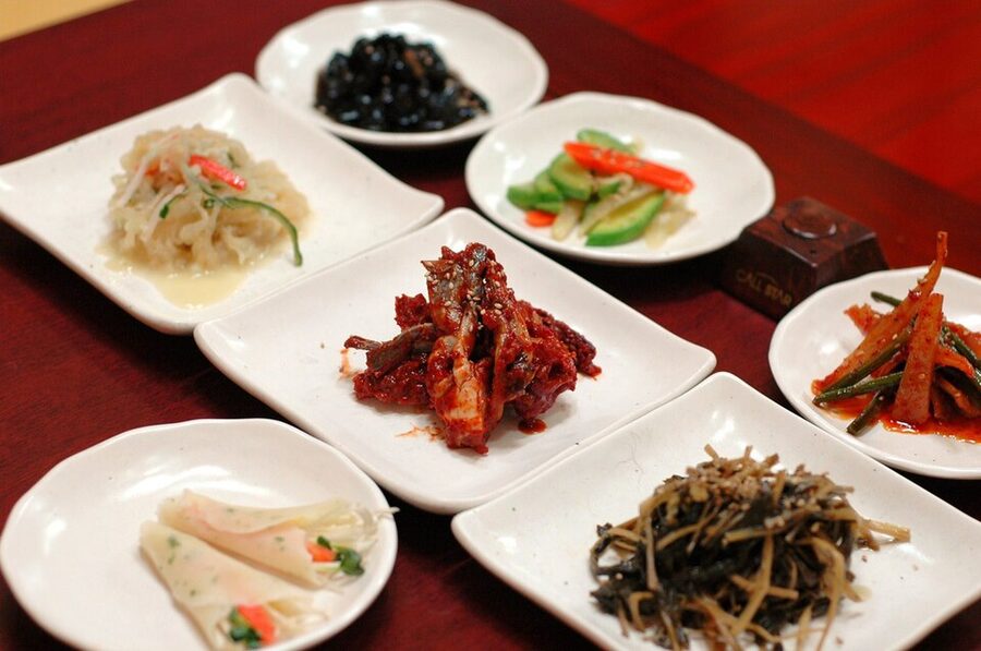 Array of Korean banchan side dishes on a table