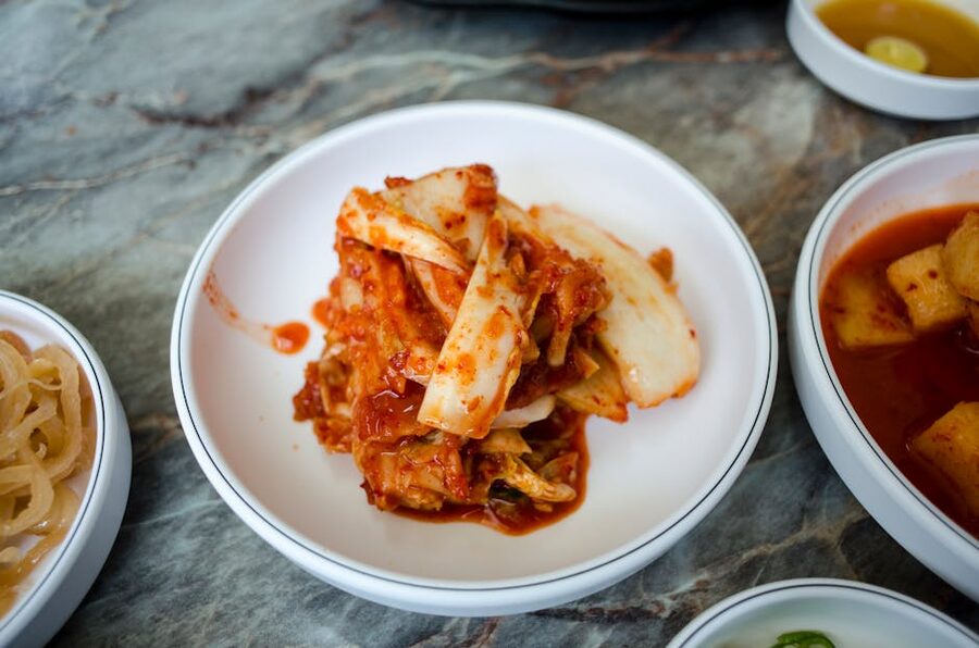 Traditional Korean kimchi in a white bowl