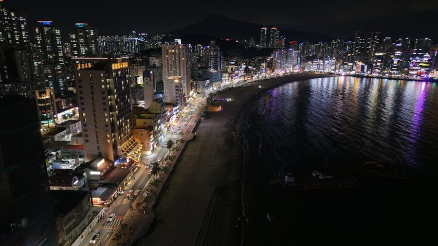 Busan skyline with beachfront at night showing coastline lights