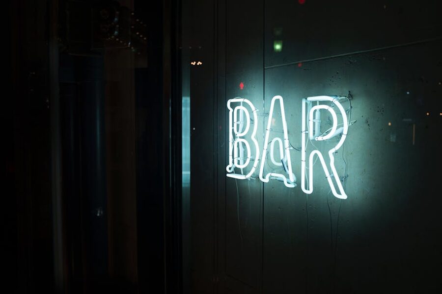 Neon BAR sign on a quiet night street