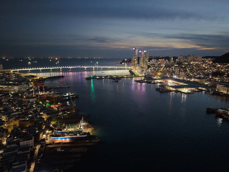 Busan harbor with ferries and mountains in the background