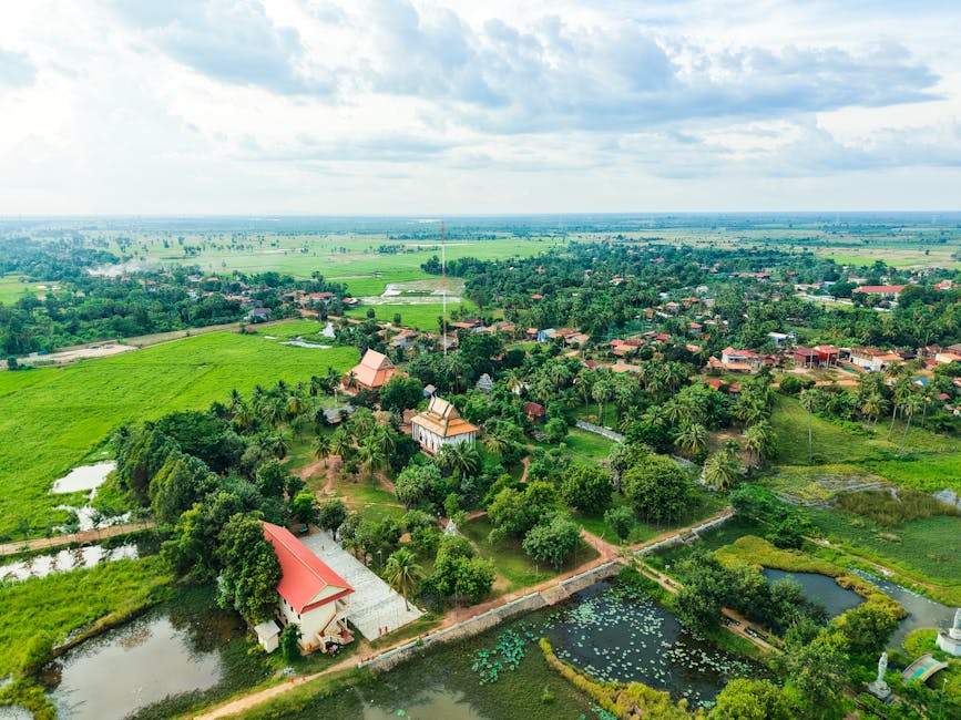 Traditional Cambodian temple in lush countryside from above