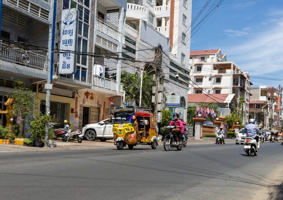 Cambodia tuk tuk driver waiting for passengers in Battambang