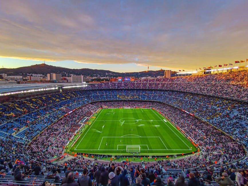 Aerial view of Camp Nou stadium during a match at sunset in Barcelona