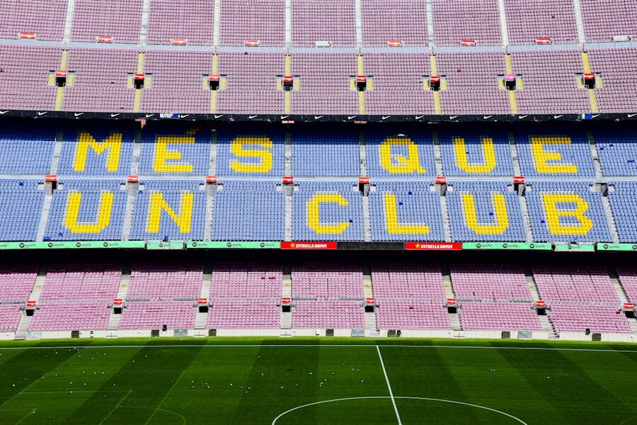 The Mes Que Un Club slogan on a wall at Camp Nou