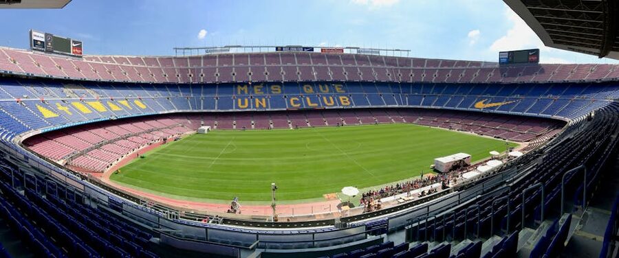 Panoramic view of Camp Nou stadium showing seating and field