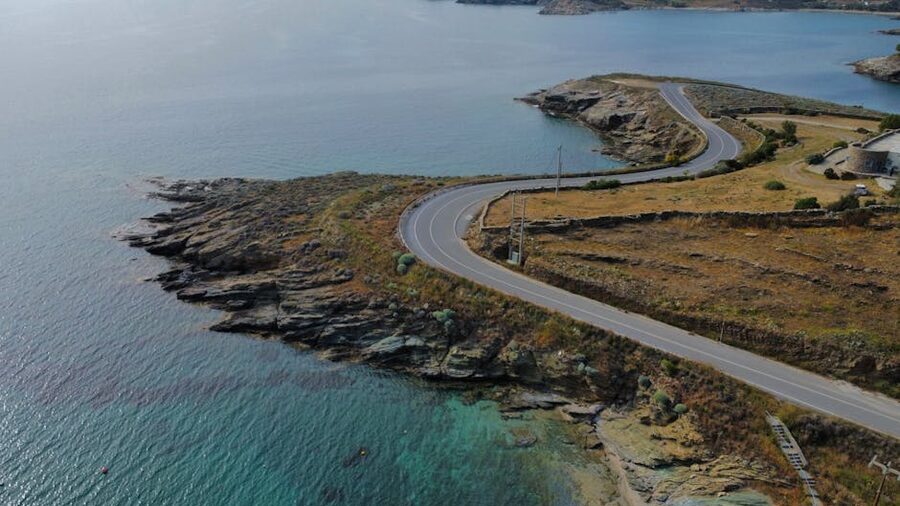 Aerial view of a winding coastal road along the Greek coastline en route to Cape Sounion