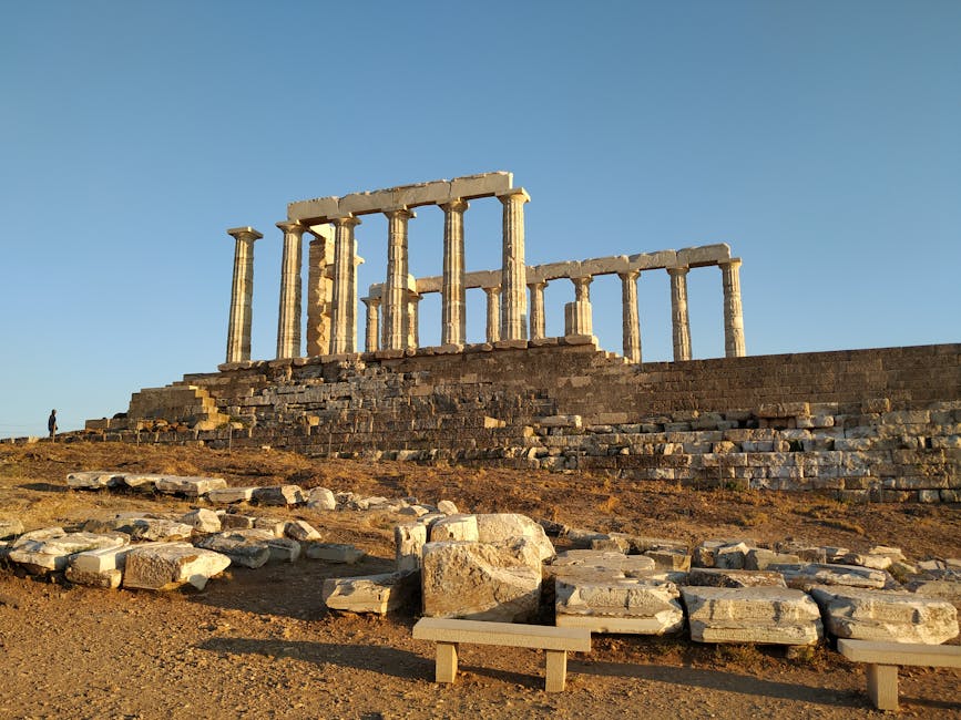 Temple of Poseidon under clear blue sky at Cape Sounion