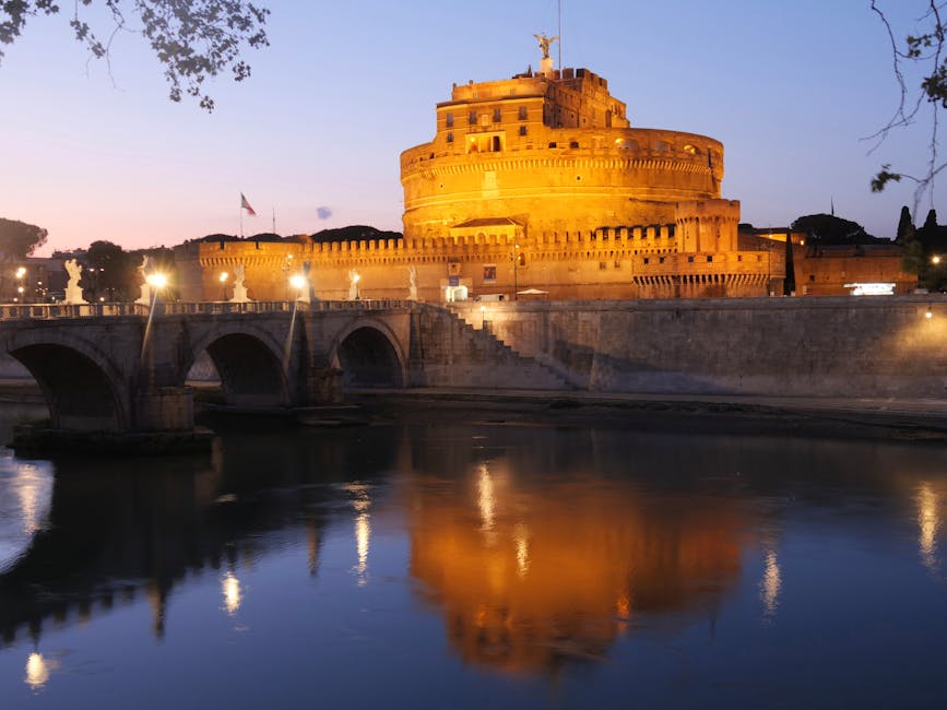Castel SantAngelo at sunset reflected in the Tiber