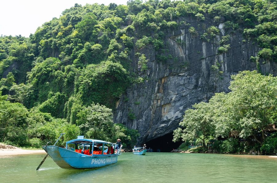 Wooden boat at a cave entrance