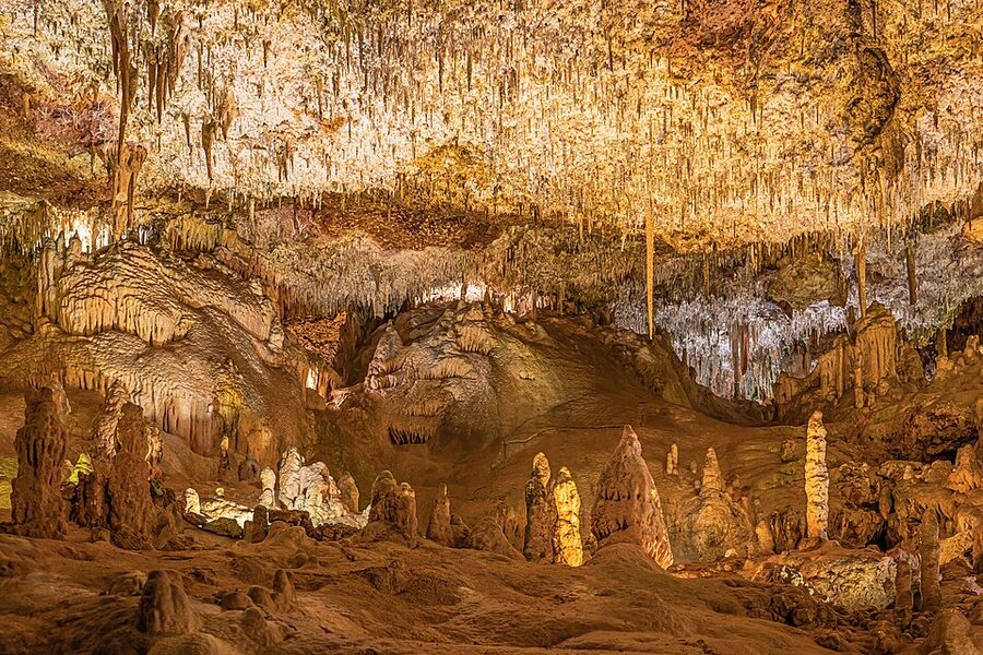 Lit passage between chambers at the Caves of Hams Mallorca