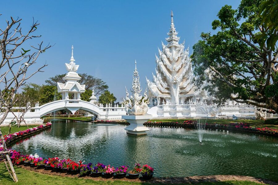 The stunning all-white facade of Wat Rong Khun, the White Temple in Chiang Rai Thailand