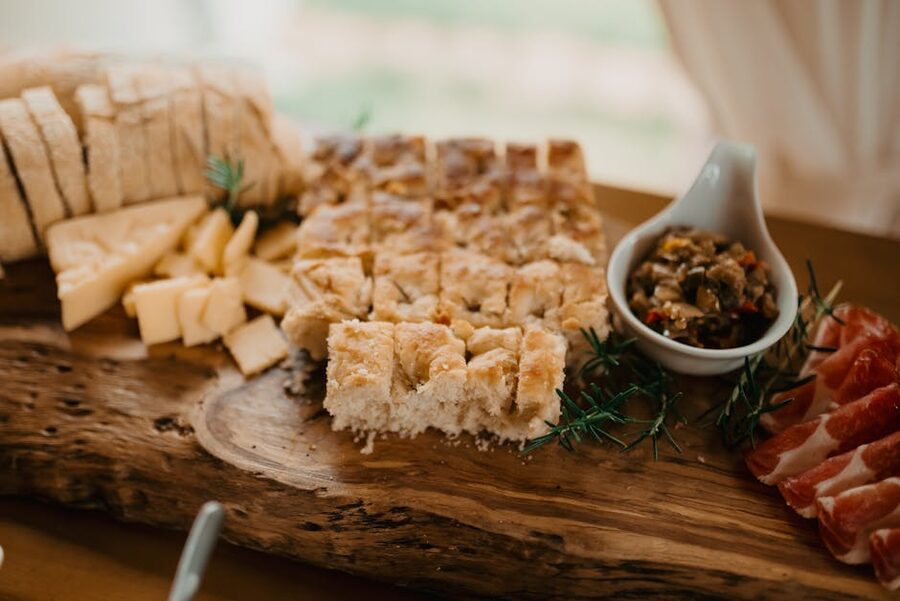 Rustic antipasto board with focaccia, cured meats, pecorino, and olives
