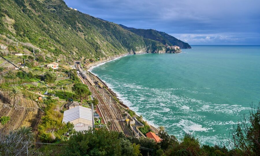 Cinque Terre coastline aerial view with railway and turquoise water