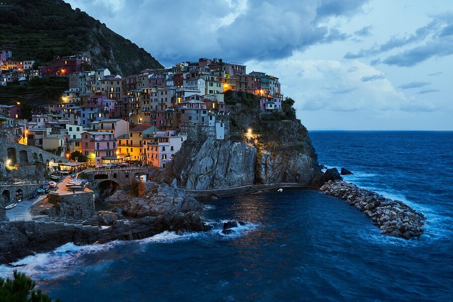 Manarola at blue hour with lights coming on