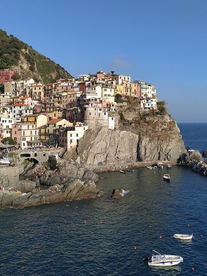 Manarola colorful houses on cliff over the sea Cinque Terre