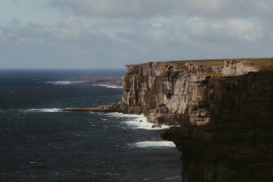 Dramatic Cliffs of Moher coastline rising out of the Atlantic in County Clare