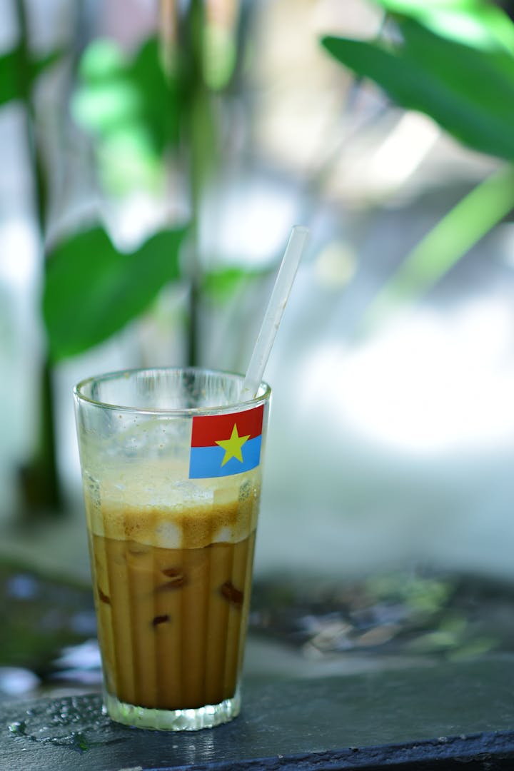 Vietnamese coconut coffee blended with coconut milk and ice in a tall glass