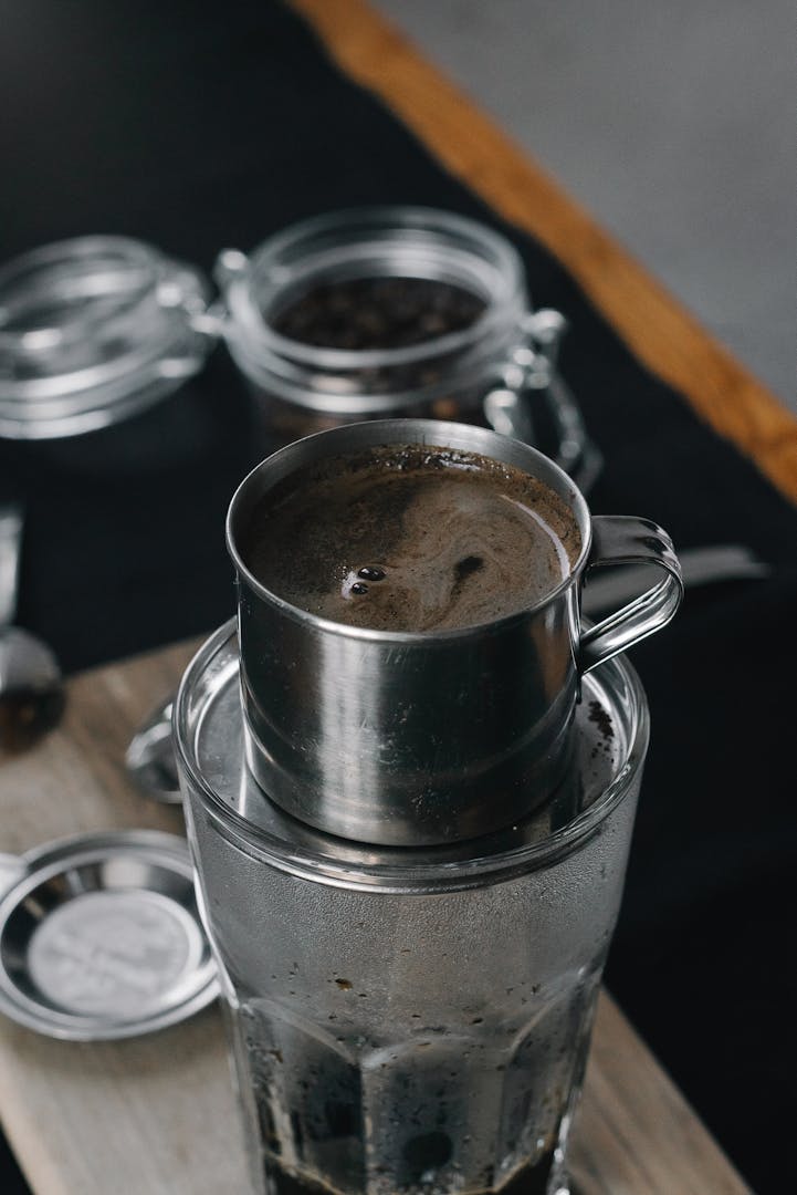 Fresh-roasted Vietnamese coffee beans in a roasting drum