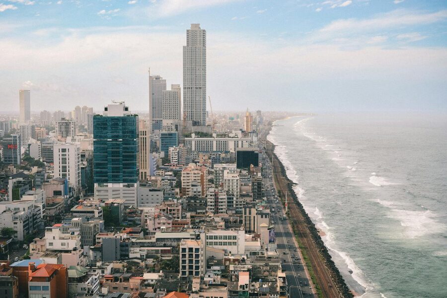 Aerial view of Colombo skyline against the Indian Ocean at dusk