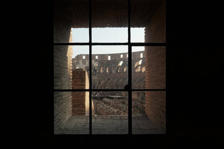 Colosseum interior viewed through arched window opening