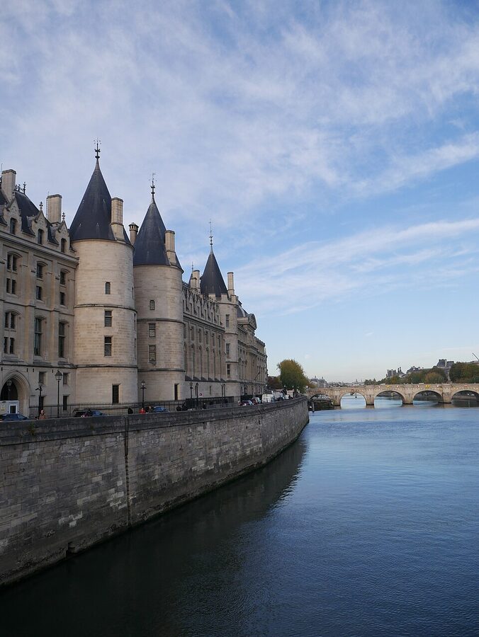 Conciergerie viewed from the Pont au Change with the Seine river in the foreground