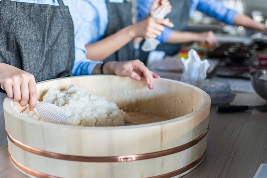 Close-up of chef preparing rice in modern kitchen