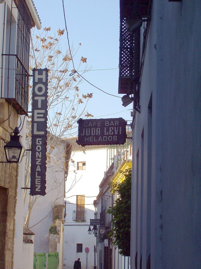 Narrow whitewashed street in the Cordoba Juderia Jewish Quarter