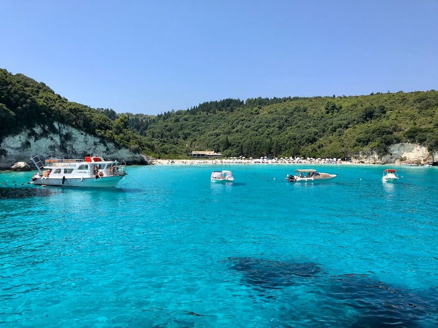 Antipaxos turquoise water boat anchored
