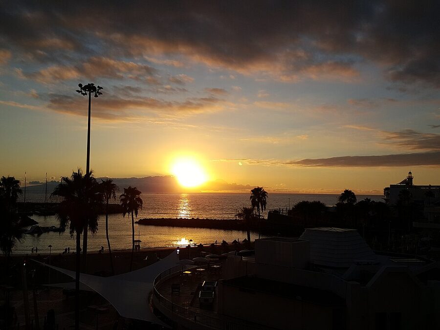 Sailing boats moored at Puerto Colon marina, Costa Adeje, at sunset