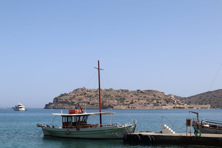 Plaka harbour traditional fishing boats Crete Spinalonga