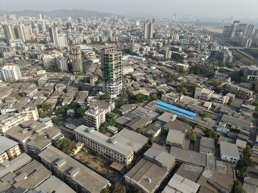 Dense aerial view of Mumbai residential neighborhood rooftops