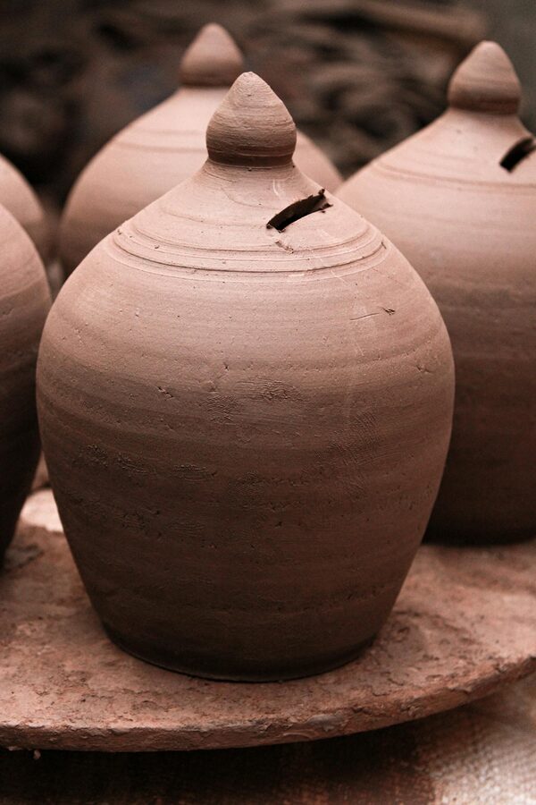Clay pots drying inside a Mumbai pottery workshop