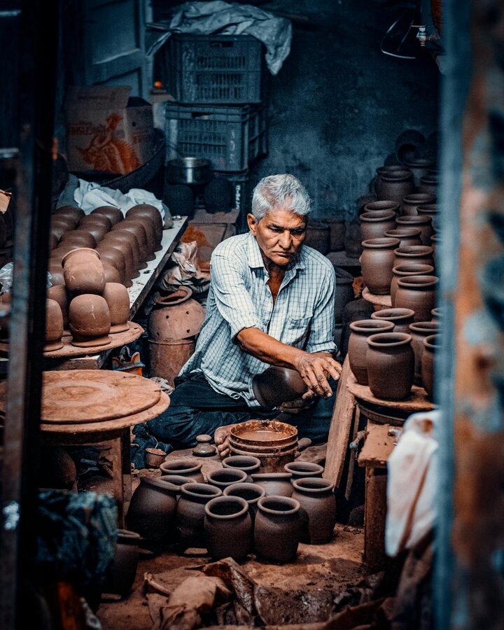 Experienced potter working clay in a traditional Mumbai workshop