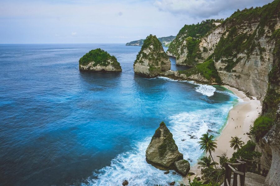 Diamond Beach on the east side of Nusa Penida with a rocky spire rising from turquoise shallows