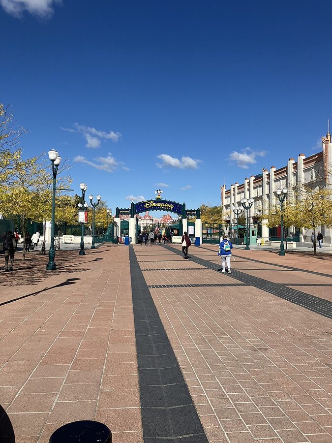 The main entrance and ticket plaza at Disneyland Paris with the Disneyland Hotel above the gates