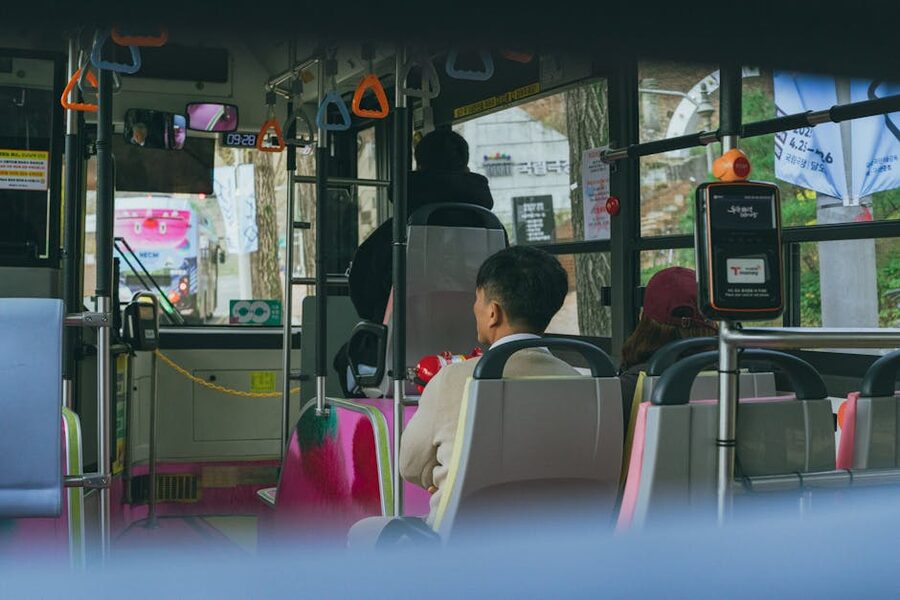 Passengers riding a Seoul city bus at dawn