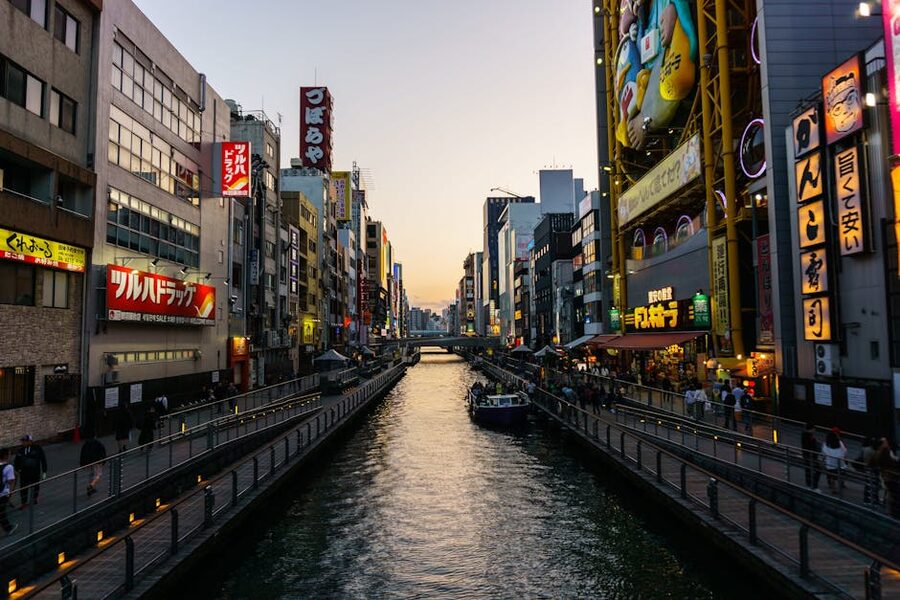 Dotonbori Canal at twilight with neon lights and lively streets Osaka