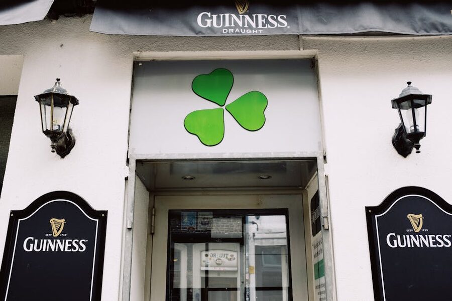 Irish pub exterior with shamrock and Guinness signage