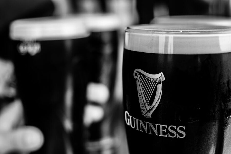Pints of Guinness in Irish pub black and white
