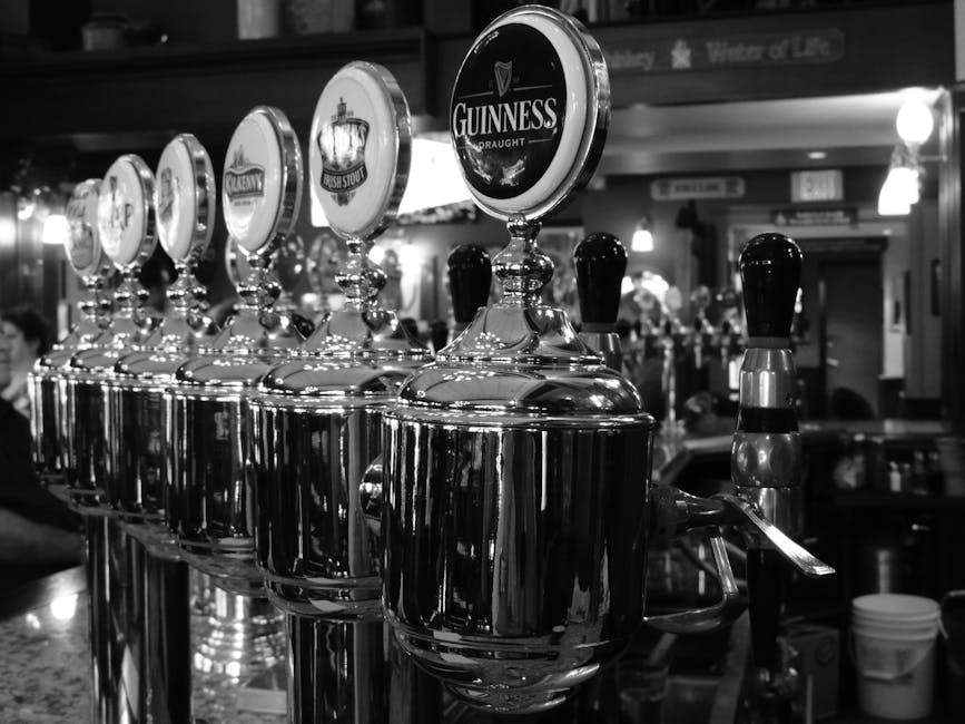 Guinness tap at bar monochrome black and white