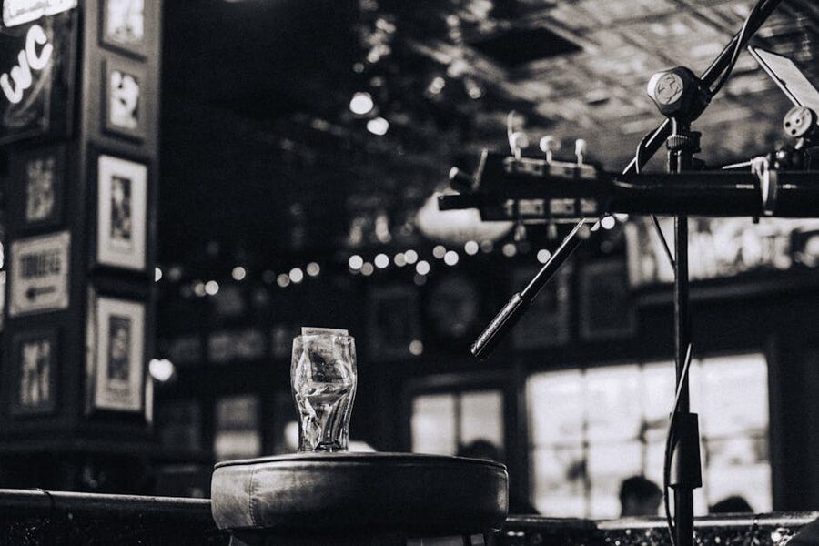 Pub setting with guitar and microphone like the IRRM rehearsal rooms