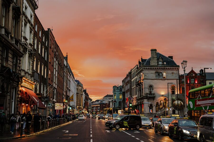 A Dublin city street lit by golden sunset light