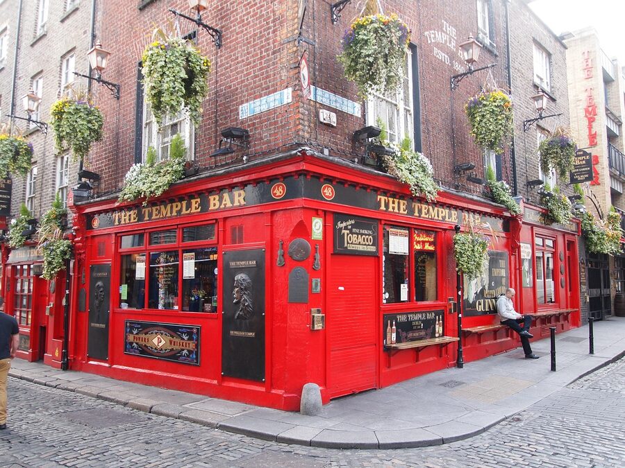 A traditional Dublin pub interior with dark wood and pints
