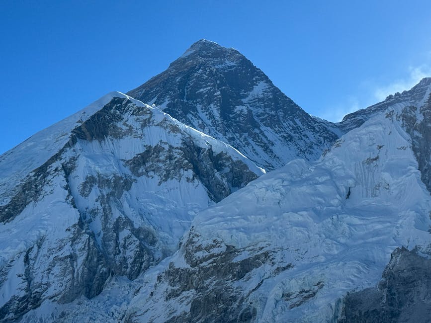 Mount Everest summit against a clear blue sky from the Nepal side