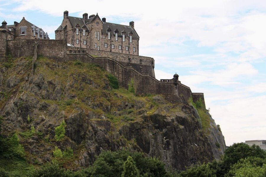 Edinburgh Castle on rocky hill with city panorama