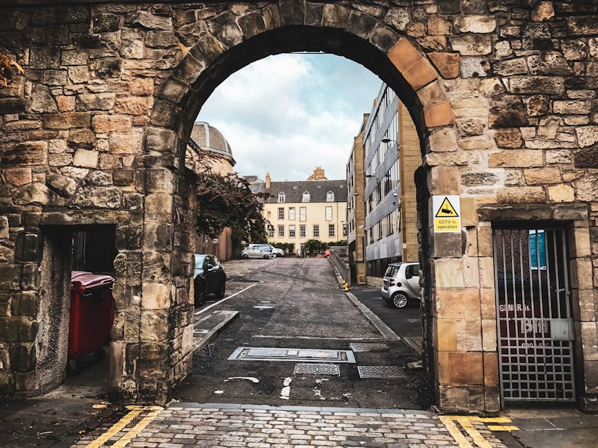 Edinburgh stone archway looking onto cobbled street